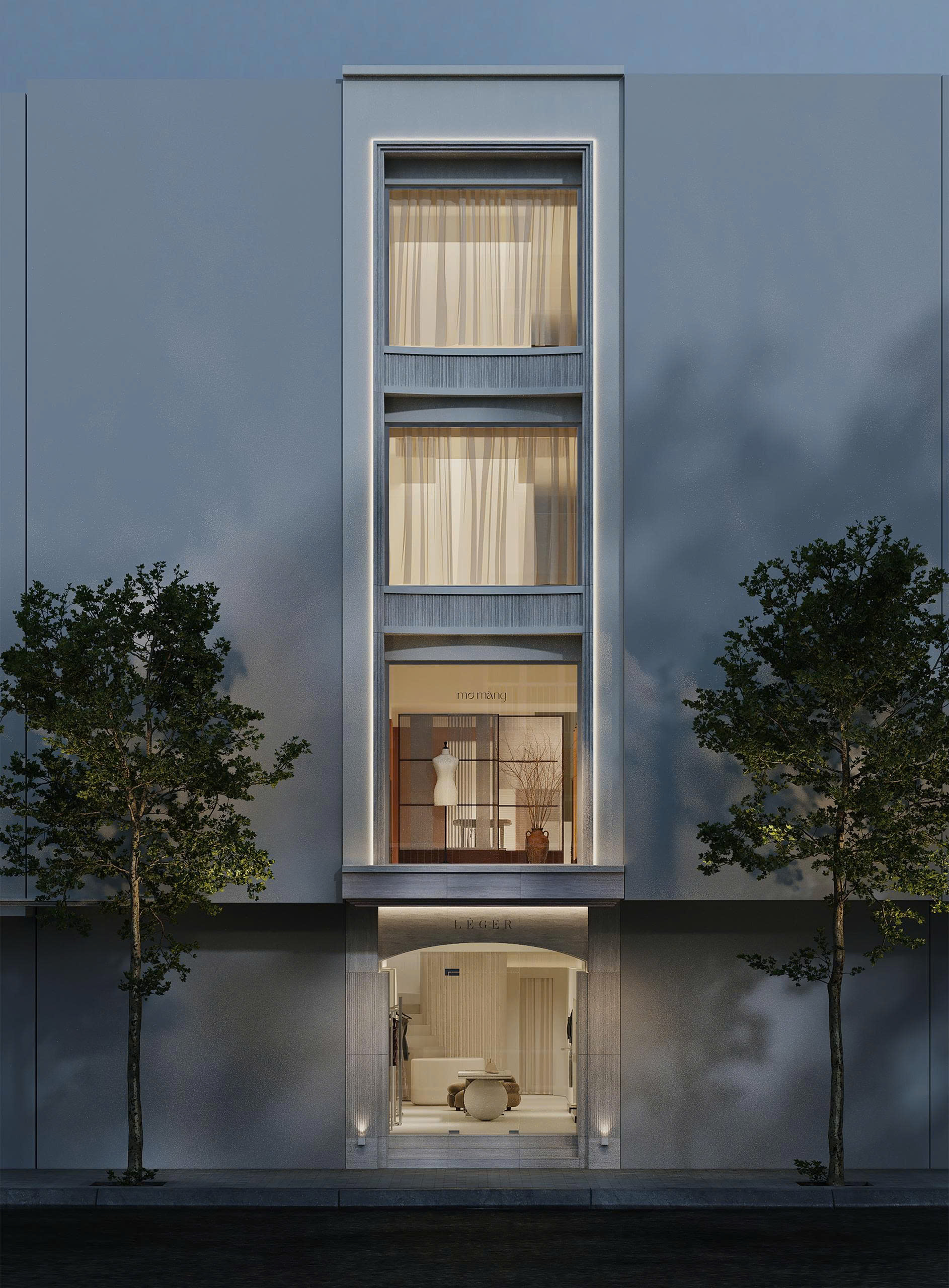 The LÉGER storefront, framed by trees and warm interior lighting
